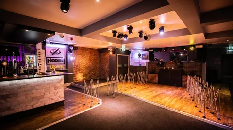 Sparkler stands set up along the dance-floor edge for a first-dance moment at Hidden Burnley.